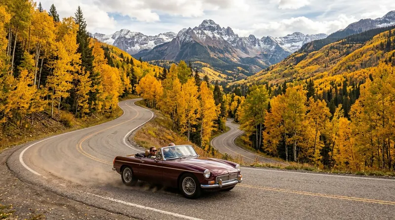 Classic convertible on a winding scenic byway through golden aspens in the San Juan Mountains